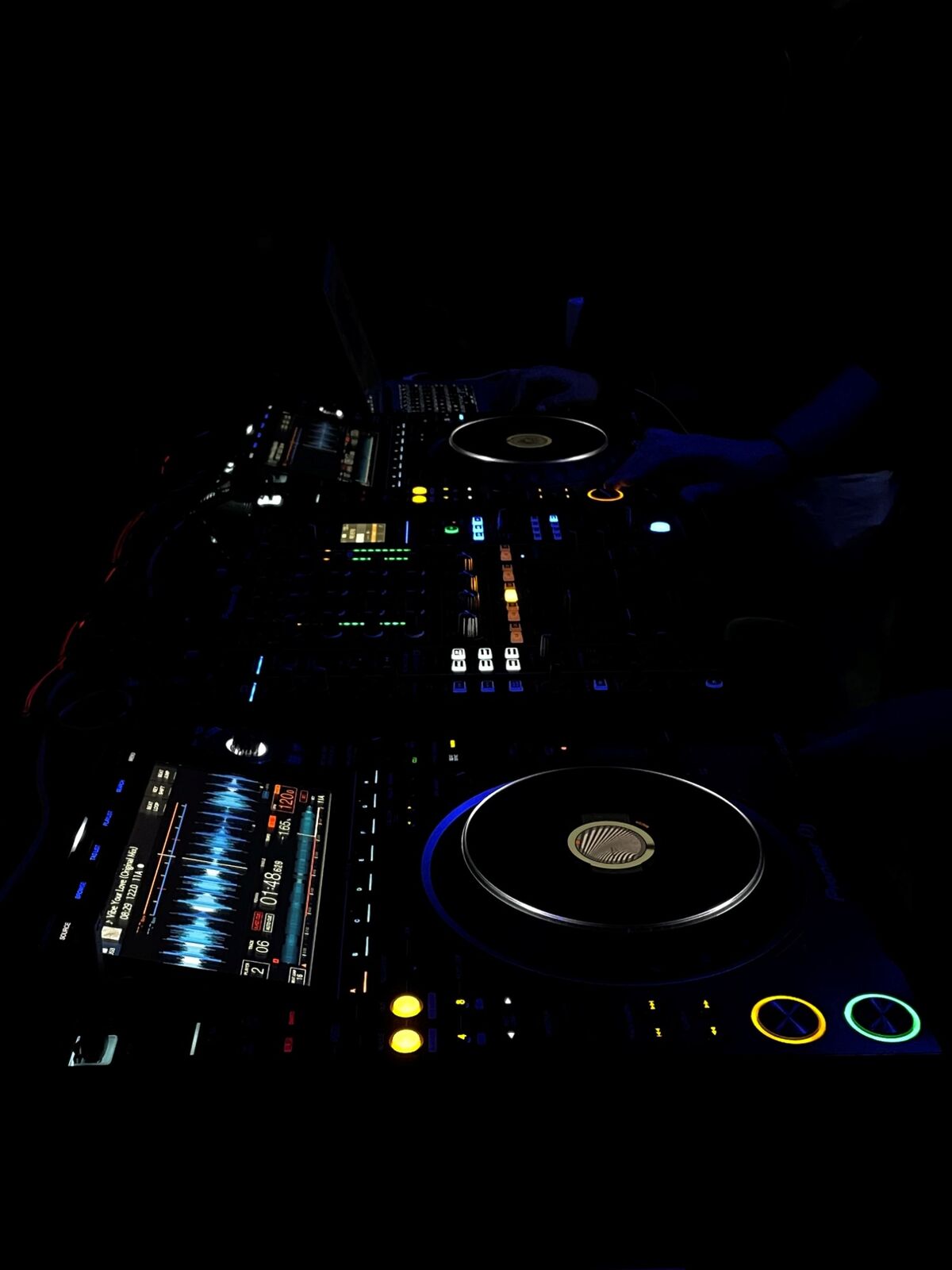 DJ hands on a mixer